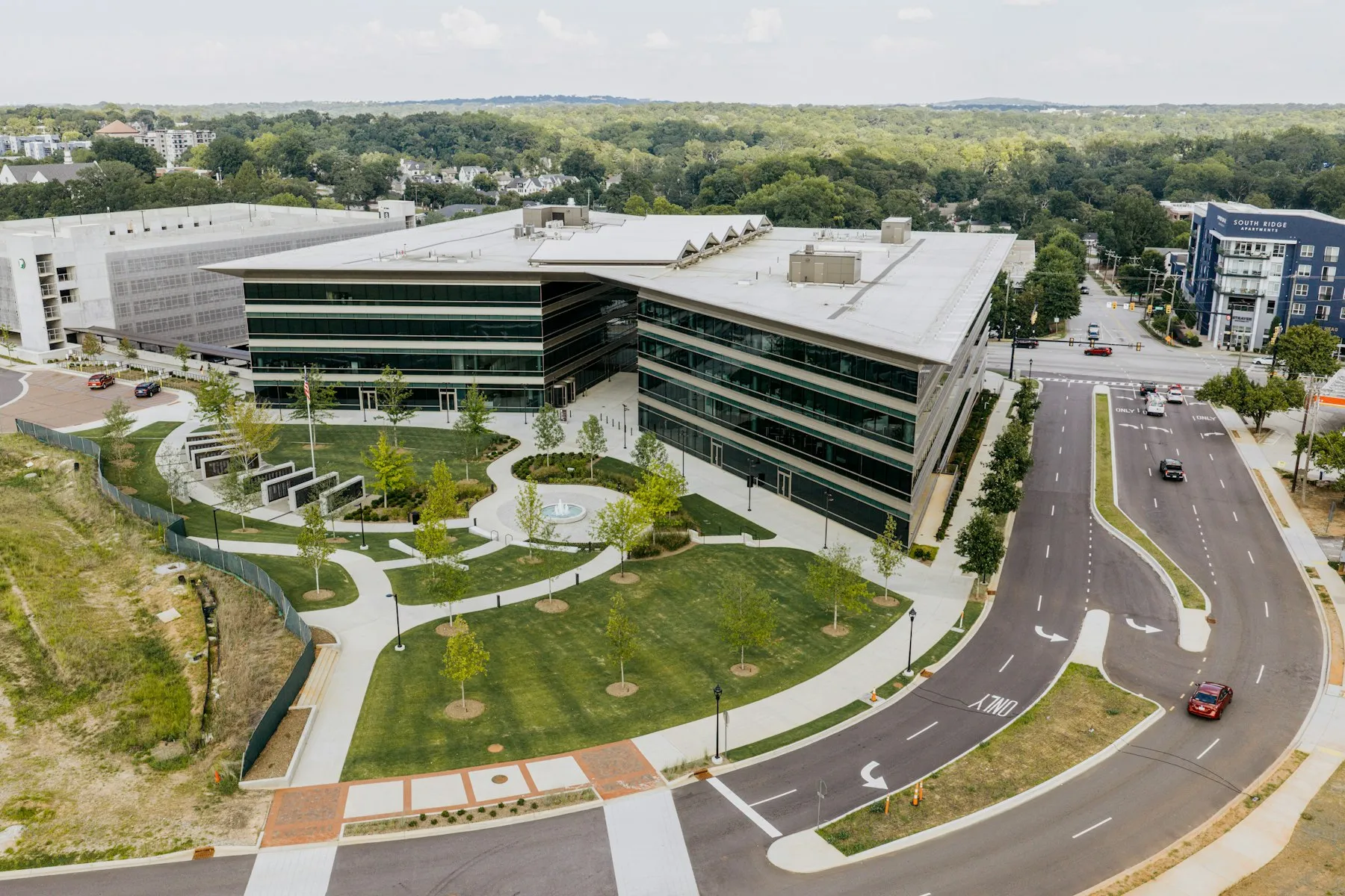 An office park from above, with a landscaped courtyard and lawns